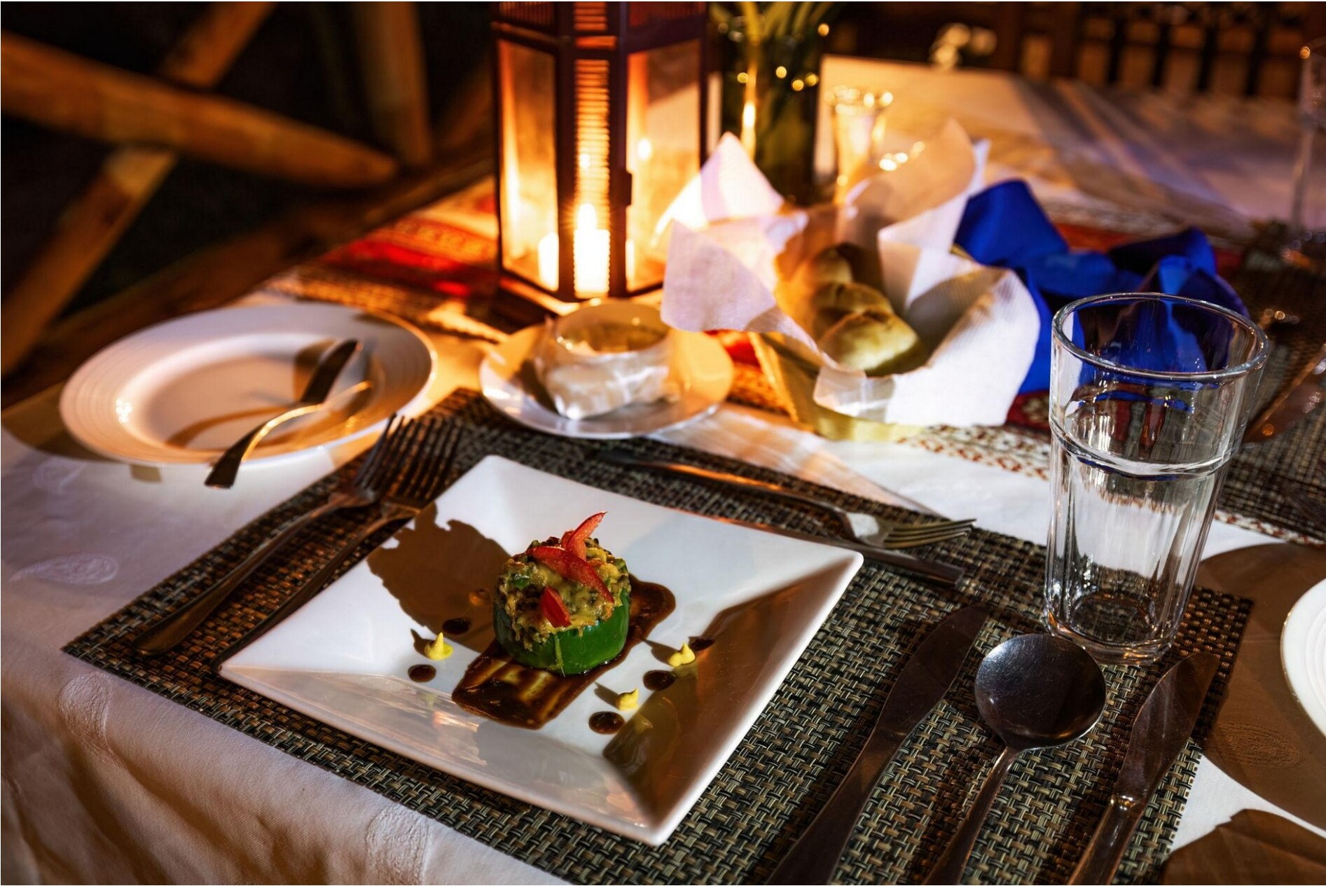 An intimate plated dinner with warm lighting