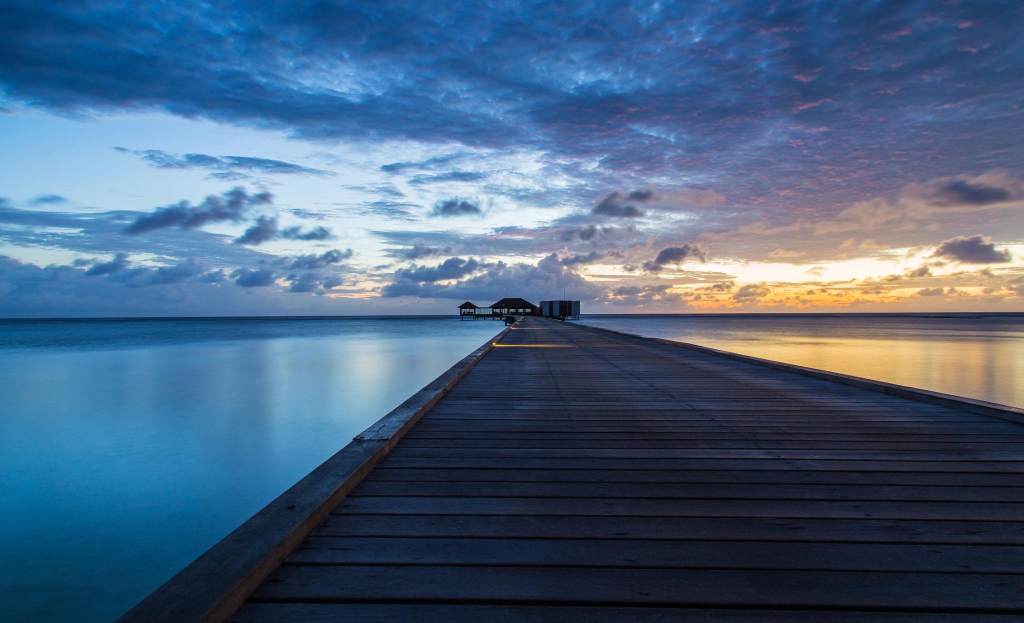 Maldives overwater villa at dawn