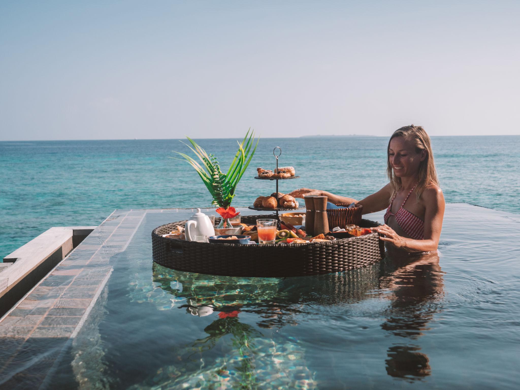 Private sandbank dining under lanterns