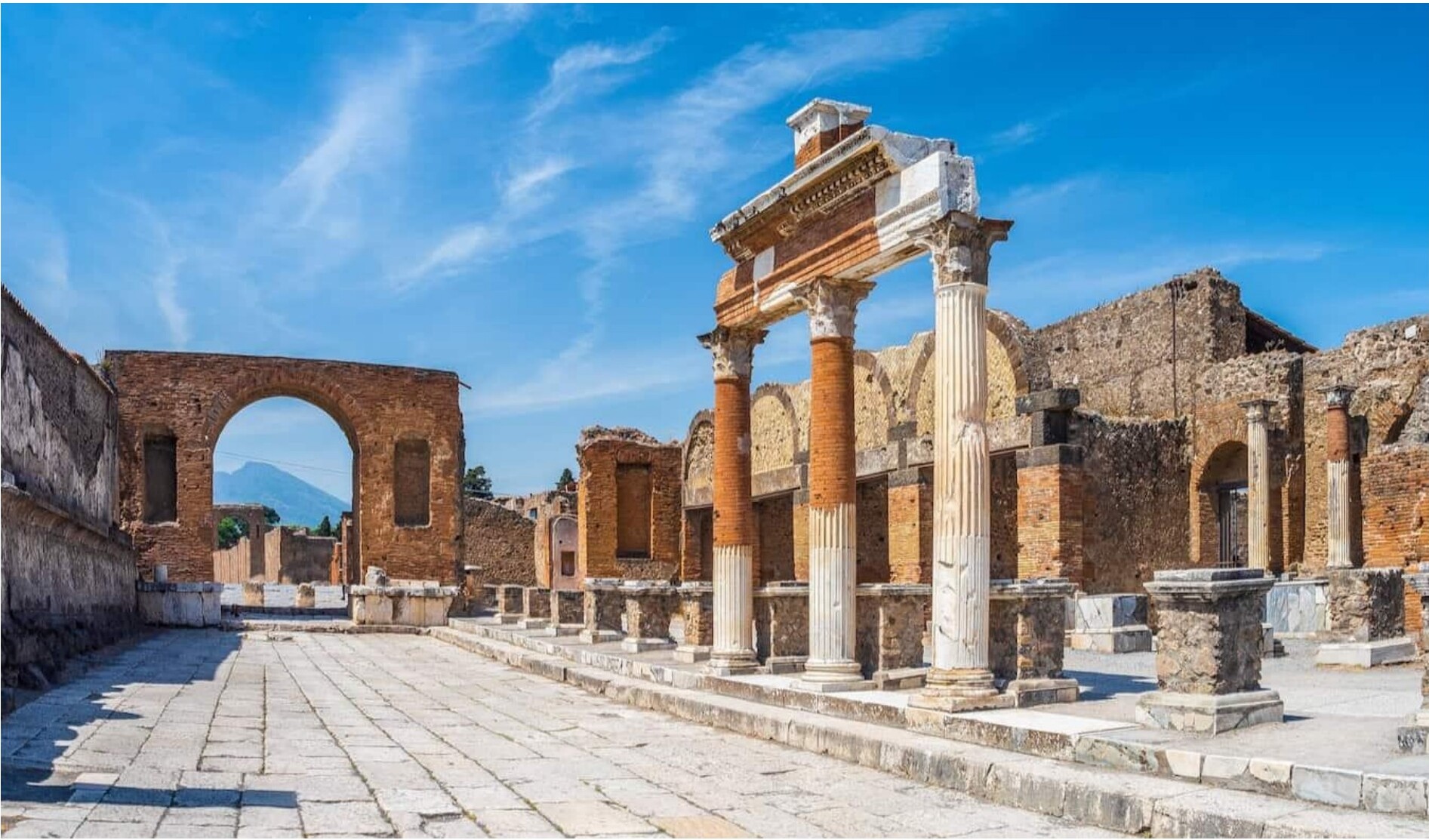 Ancient ruins of Pompeii with columns and arches