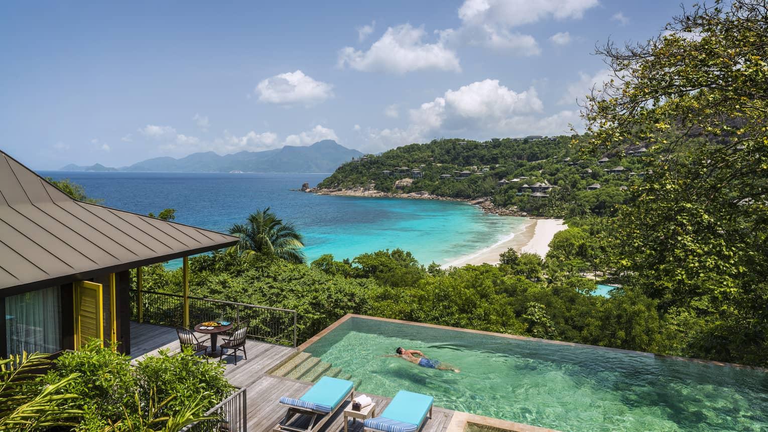 Granite boulders rising from a turquoise cove in Seychelles
