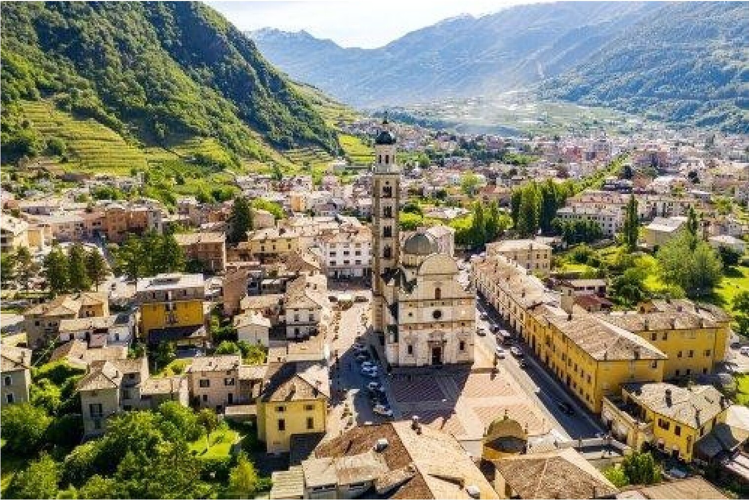 An aerial view of a town nestled in a valley.